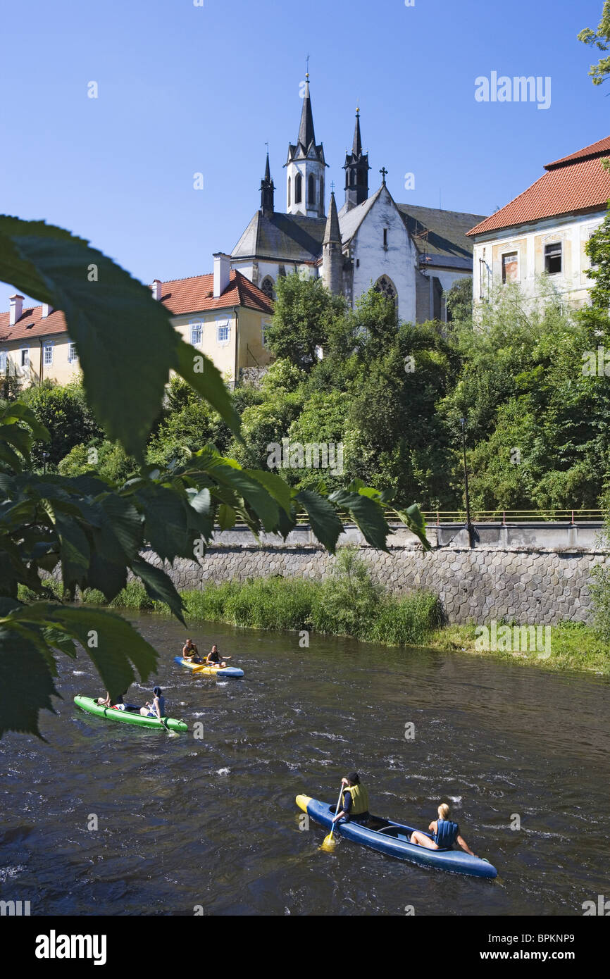 Canoers on the Vltava river with the Cistercian monastery Vyssi Brod in the back, South Bohemian Region, Czech Republic Stock Photo