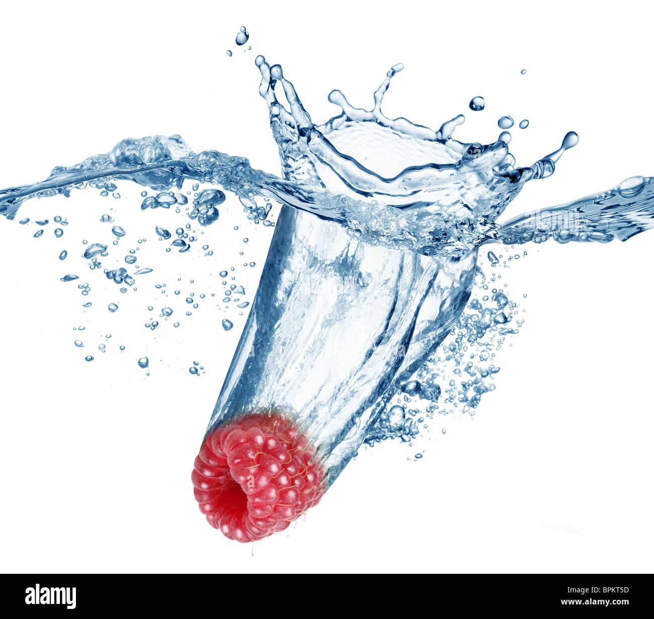 Raspberry falls deeply under water with a big splash. Stock Photo