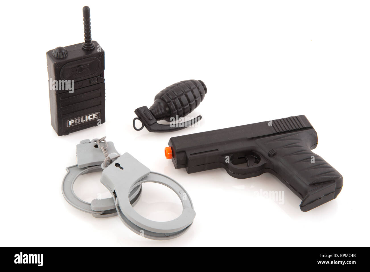 Police equipment with walkie talkie hand cuffs gun and trench bomb Stock Photo