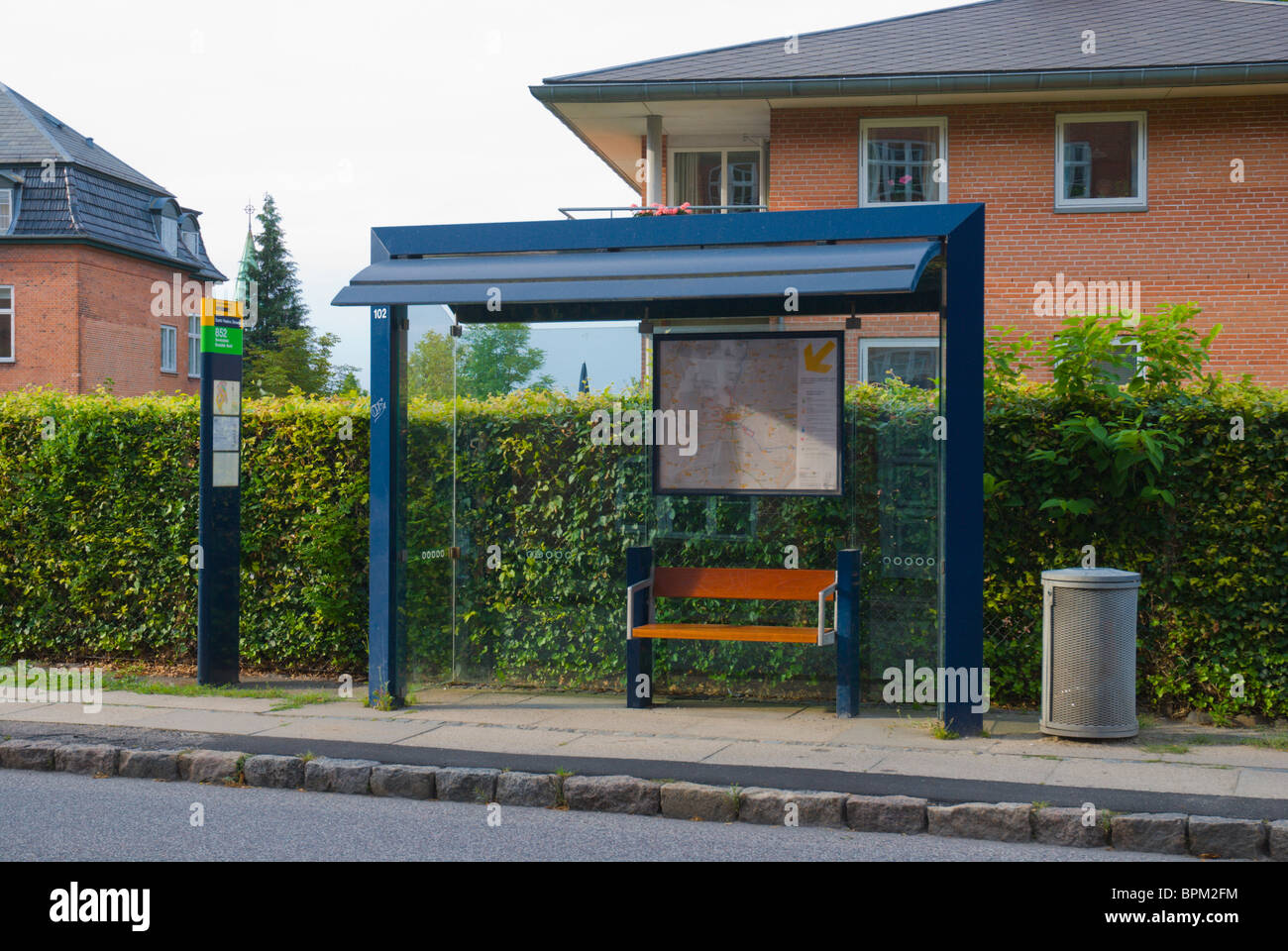 Bus stop shelter in residential area central Roskilde Denmark Europe Stock Photo