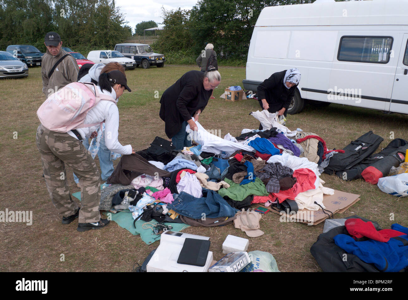 Buyers hunt for bargain clothes at car boot sale at Apps farm, Surrey, England Stock Photo