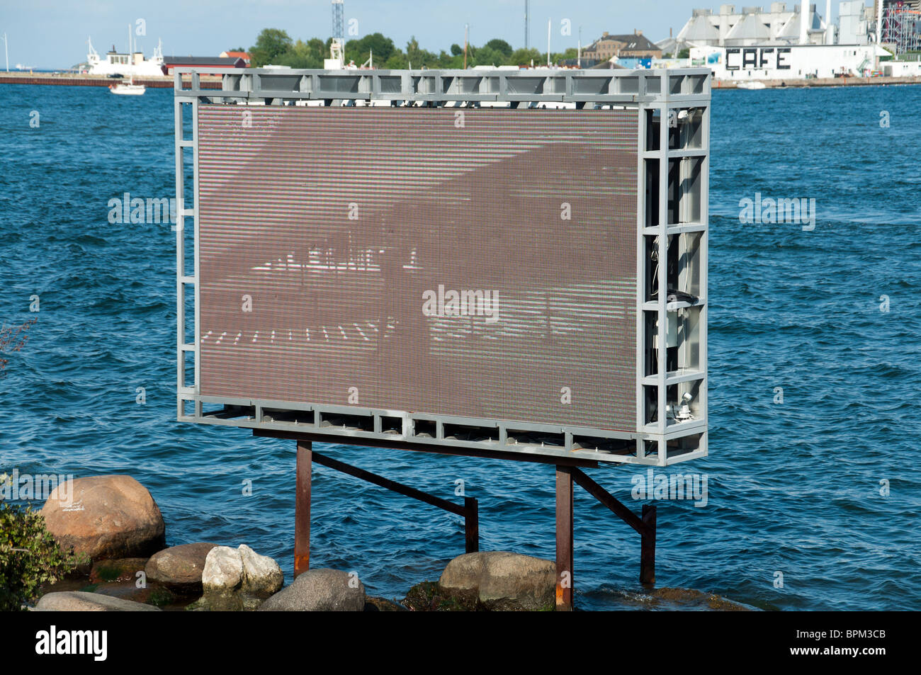 An LED-screen which has temporarily replaced The Little Mermaid at Langelinie in the port of Copenhagen, Denmark. Stock Photo