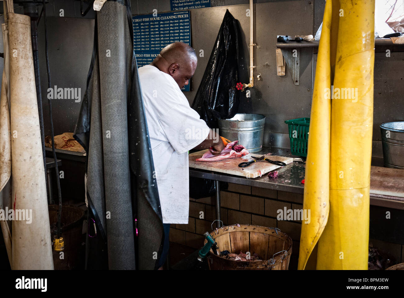 WASHINGTON DC, USA Cleaning fish at the Maine Avenue Fish Market in
