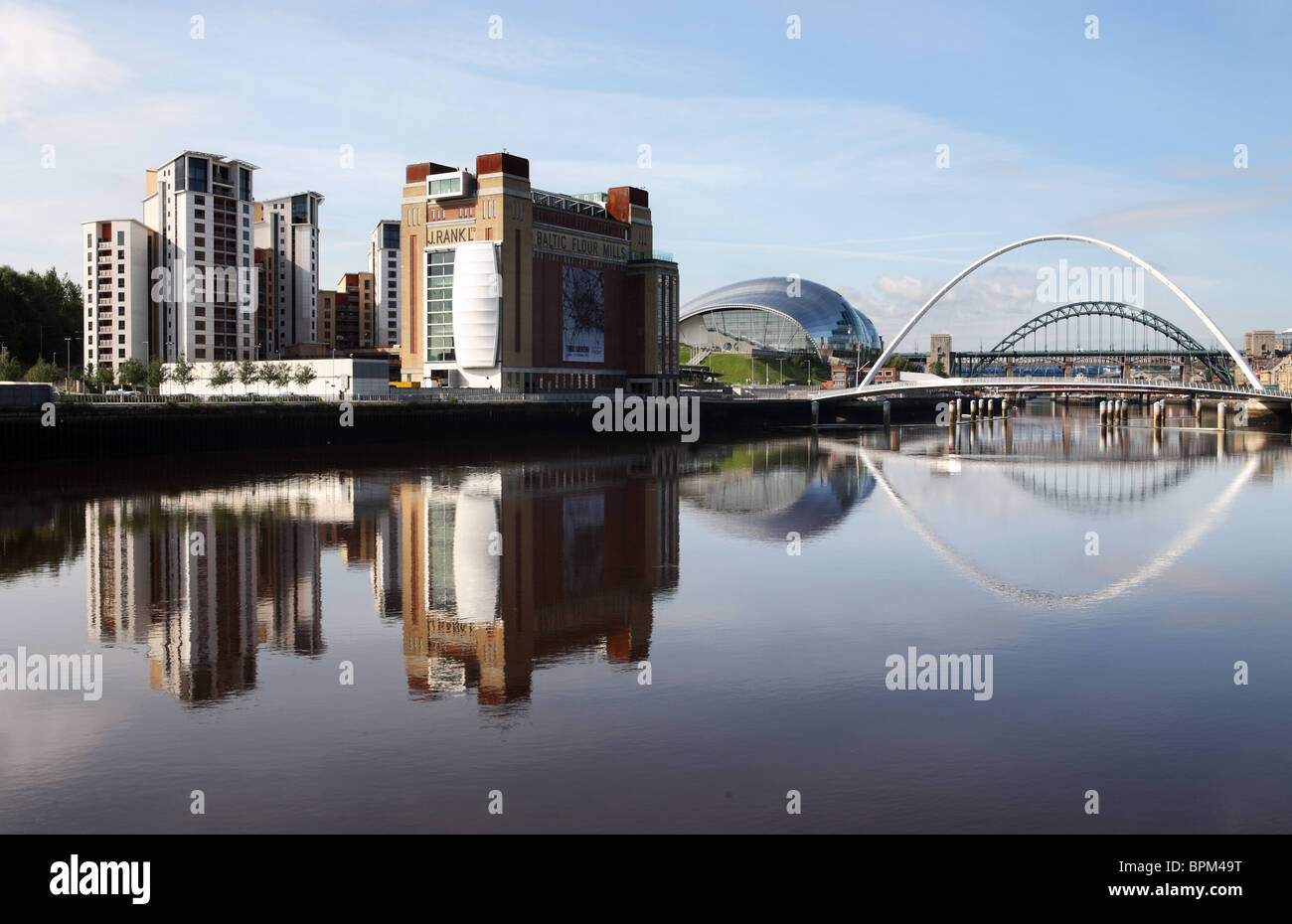 Gateshead riverside including the Baltic Arts Centre and the Sage concert hall reflected in the river Tyne. England, UK. Stock Photo