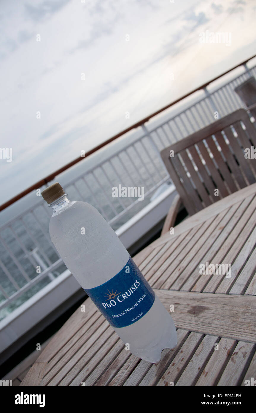 A large chilled P&O Cruises still mineral water bottle on a table at the  stern of the P&O Cruise ship 'Aurora' Stock Photo - Alamy