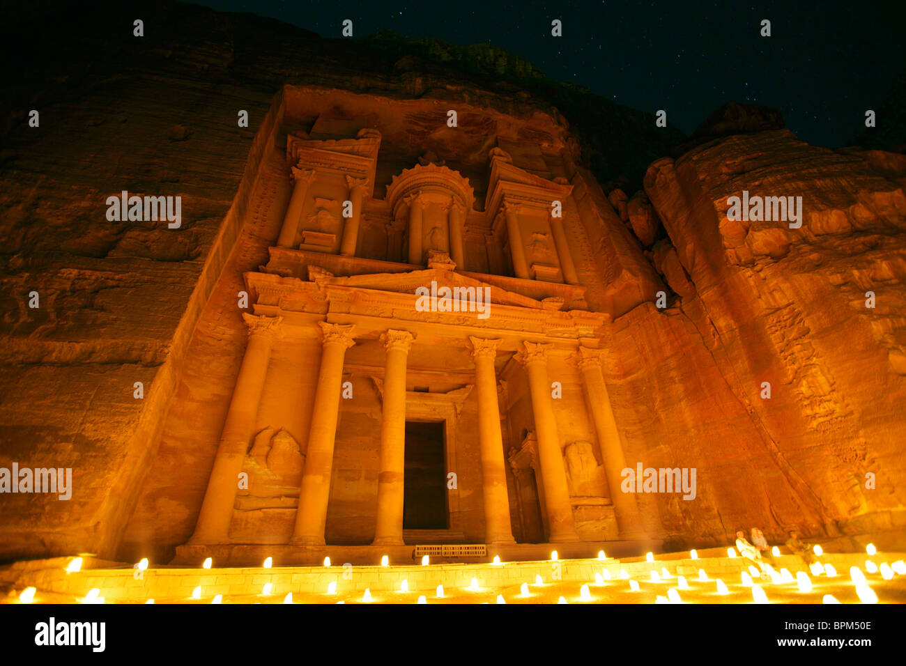 Al Khazneh (or Treasury) by night illuminated by candlelight, Petra, Jordan Stock Photo