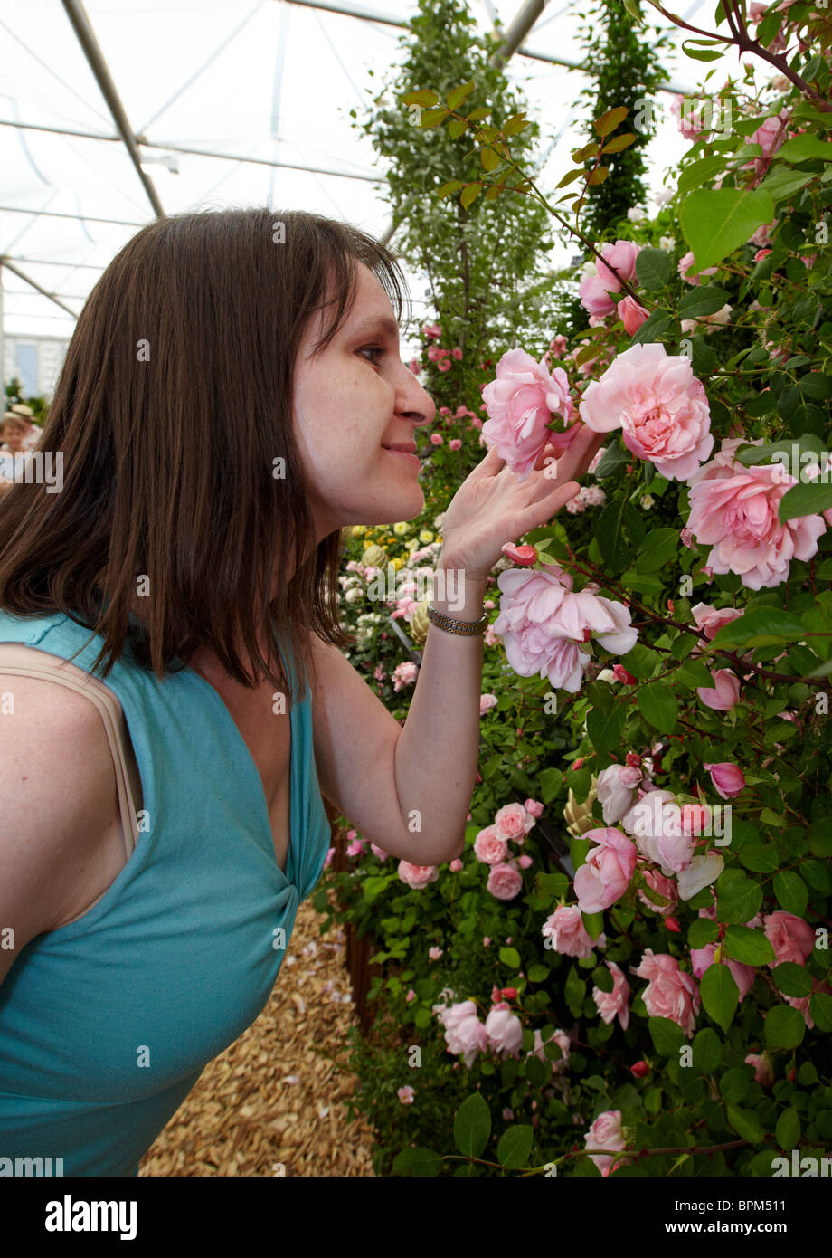 Smelling Roses Inbloom Woman Smelling Roses At The Chelsea Flower Show London UK Stock Photo ...
