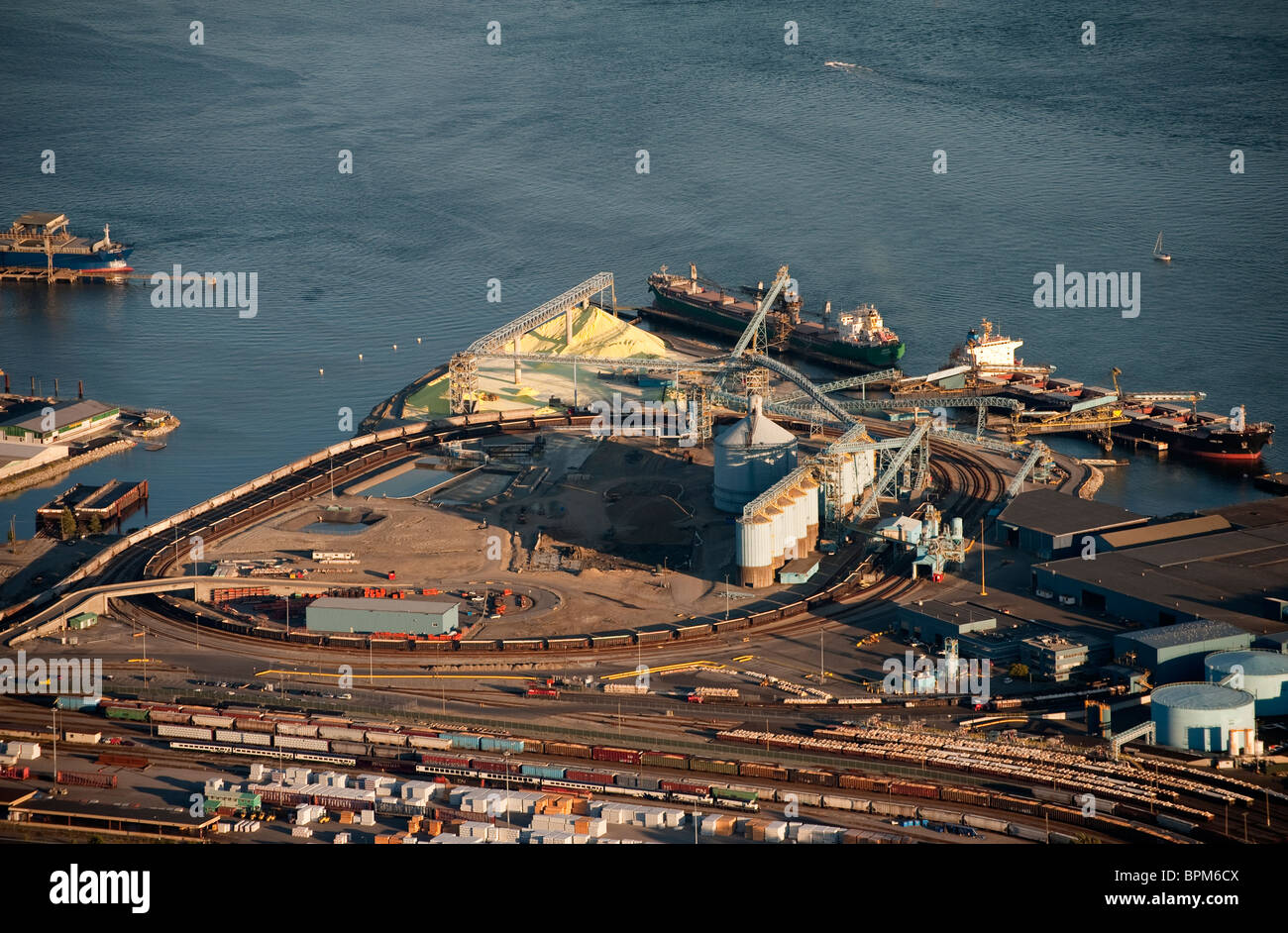 Cargo ships loading sulfur at North Vancouver Sulfur Terminal, aerial, Pacific Rim, maritime, ships, commodities Stock Photo