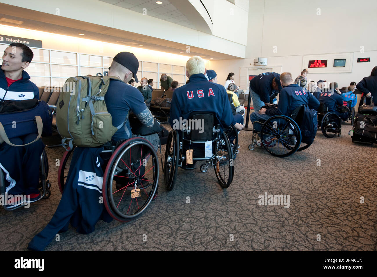 Members of the US Men's Wheelchair rugby team at the San Fransisco Airport on their way to Beijing, China for the Paralympics. Stock Photo