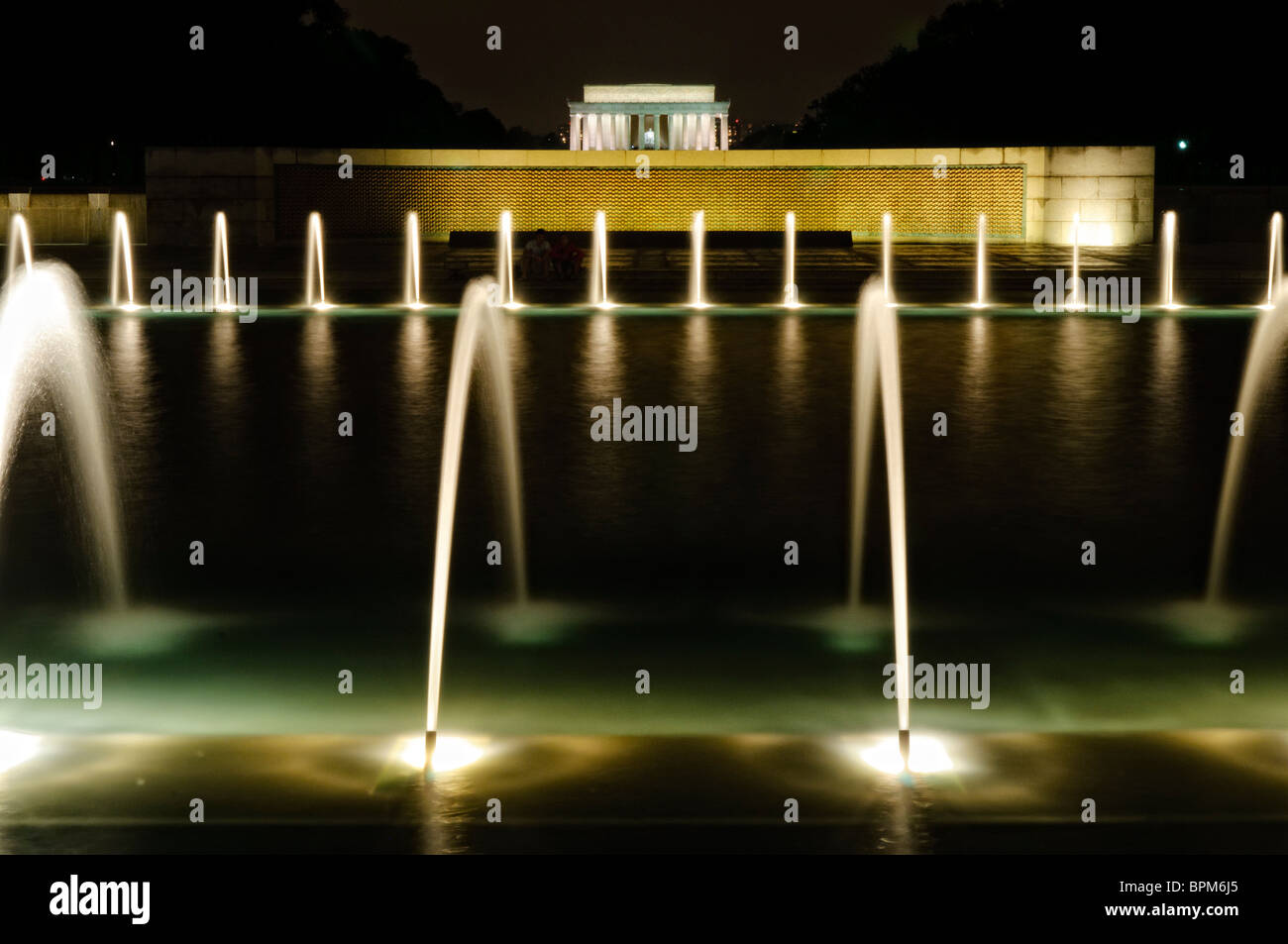 WASHINGTON DC, USA - Night shot of the fountains of the National World War II Memorial with the Lincoln Memorial in the distance. Stock Photo