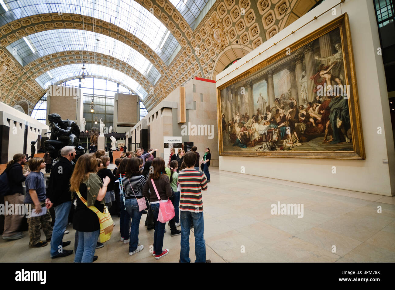 PARIS, France A school tour group gets instructed on the paintings a