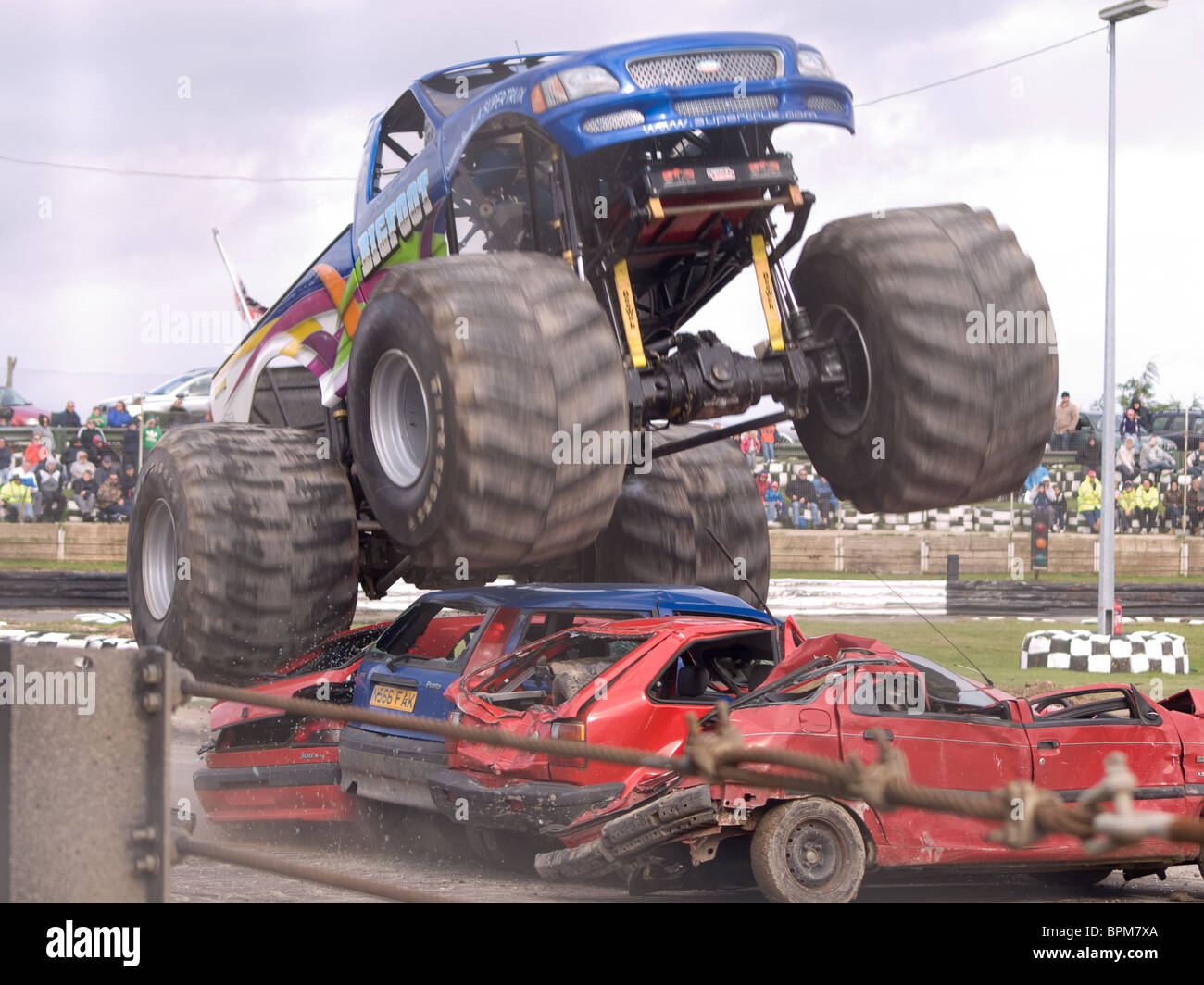 big foot crushing cars Stock Photo Alamy