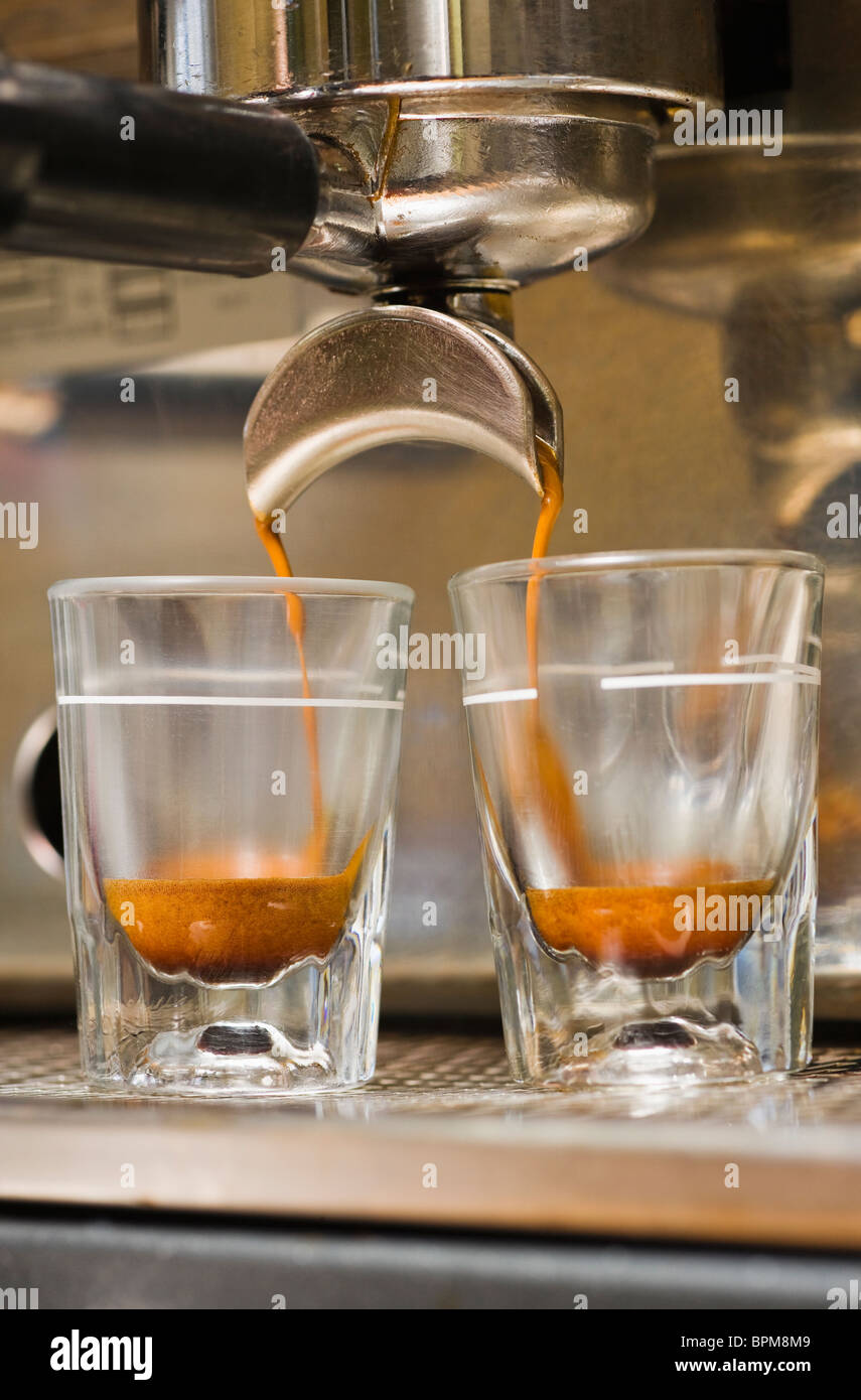 https://c8.alamy.com/comp/BPM8M9/close-up-of-espresso-machine-and-shot-glasses-during-a-pour-BPM8M9.jpg