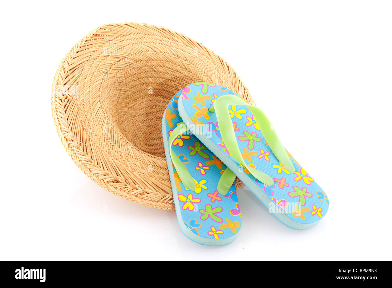 Summer straw hat and flip flops with flowers Stock Photo - Alamy