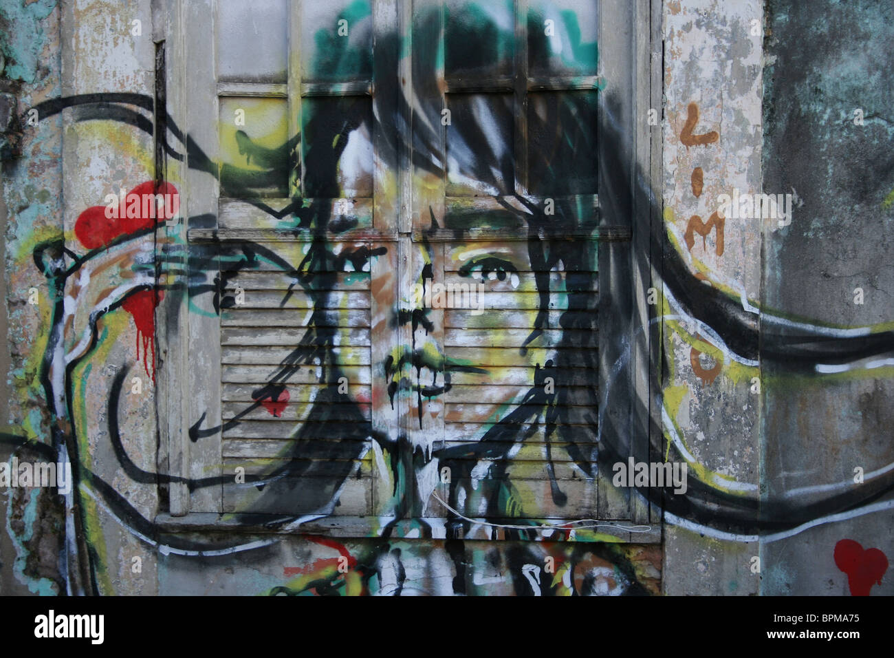 Graffiti on window in Salvador, Brazil Stock Photo