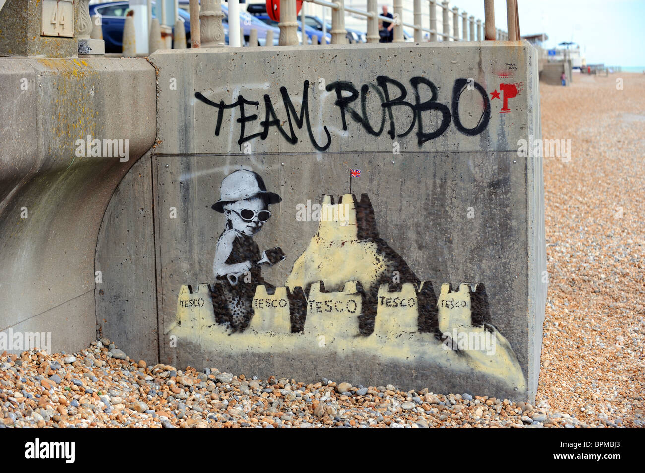 Latest work by Banksy which has appeared on St Leonard's seafront, it has already been defaced and now has a protective cover Stock Photo