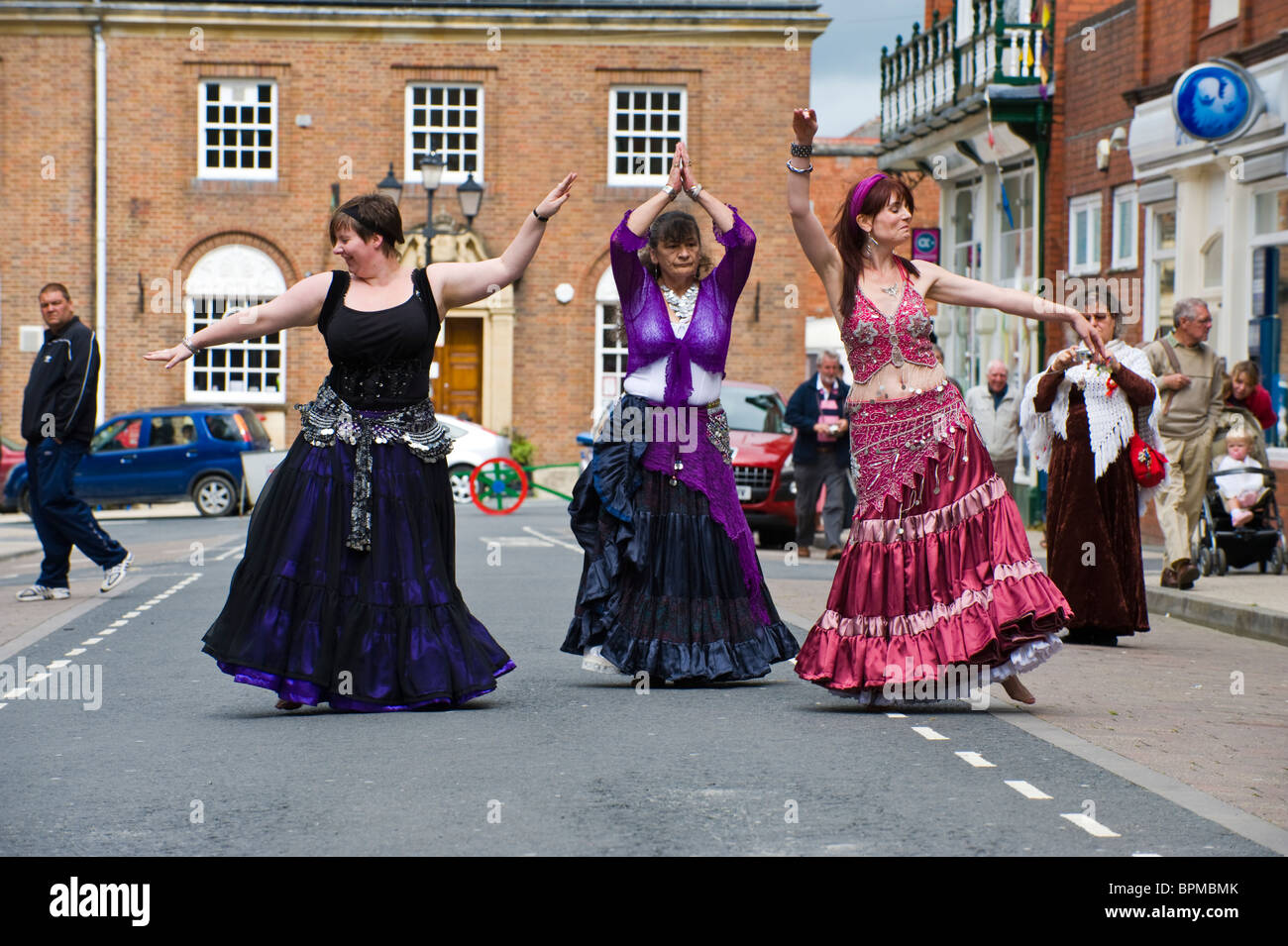 Belly dancers perform in the street during Llandrindod Wells Victorian Festival Powys Mid Wales UK Stock Photo