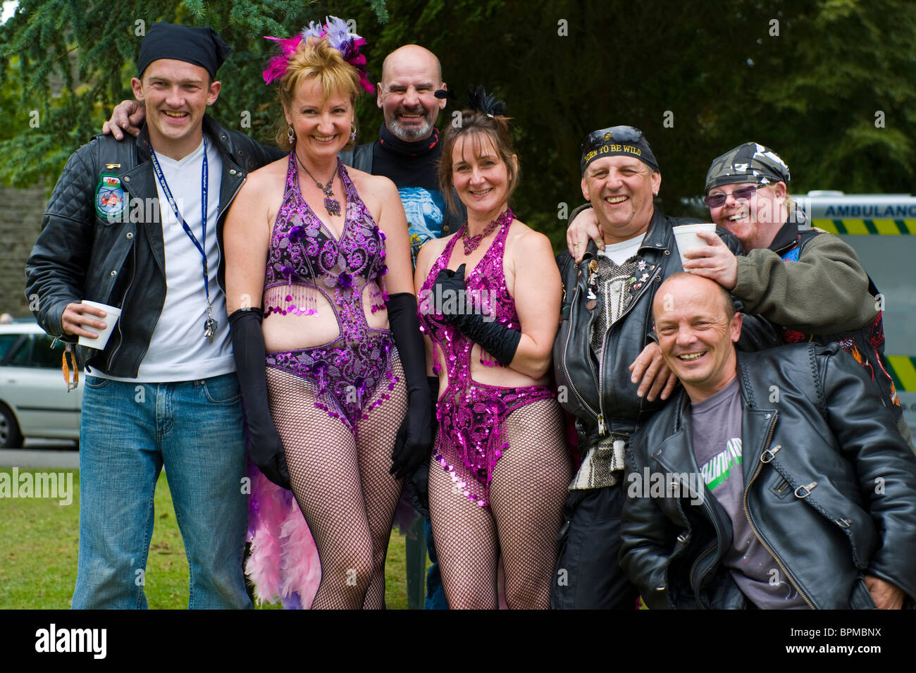 Exotic dancers and bikers pose during Llandrindod Wells Victorian Festival Powys Mid Wales UK Stock Photo