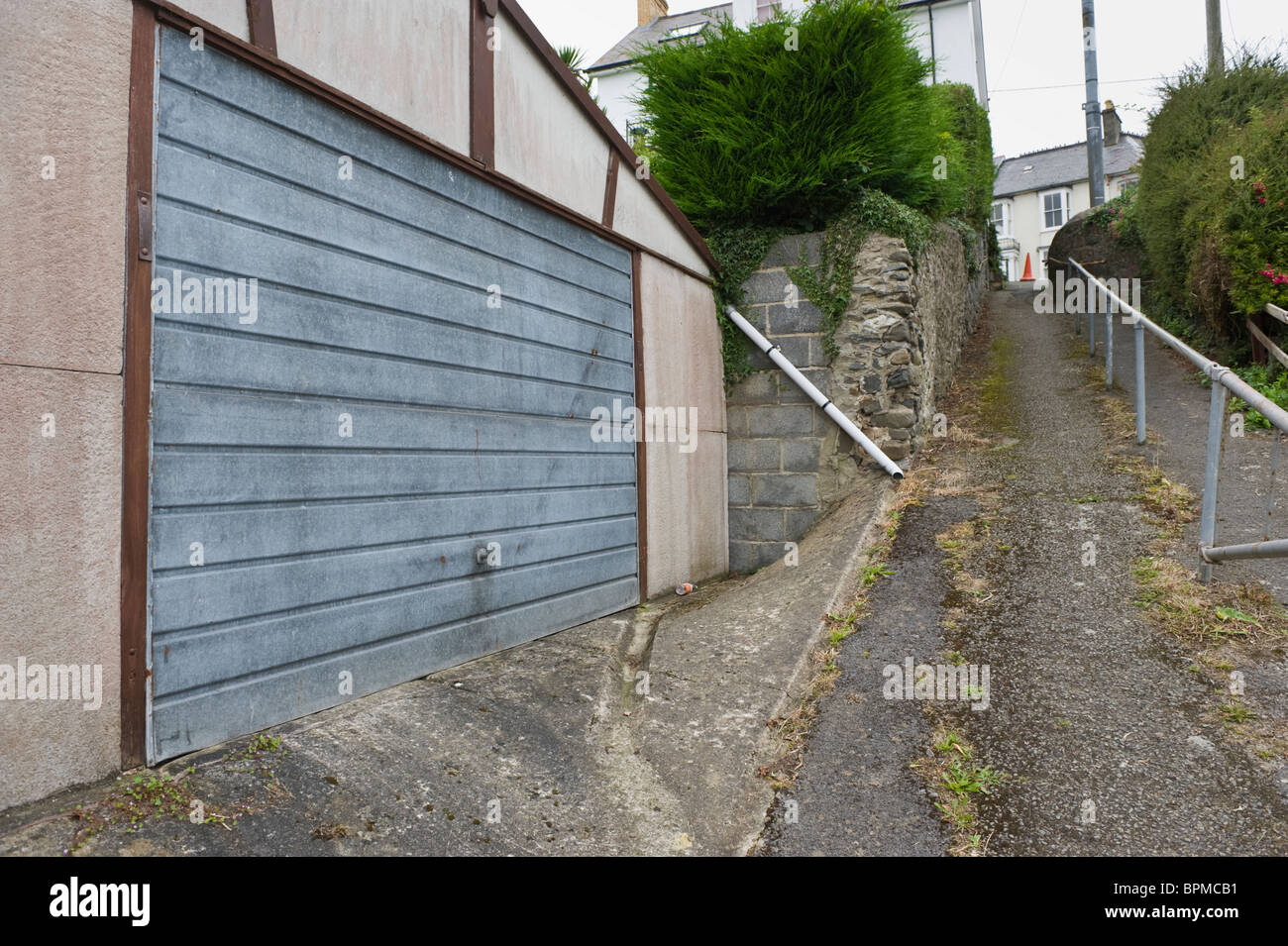Garage And Footpath Wth Handrail On Backstreet In Coastal Town Of