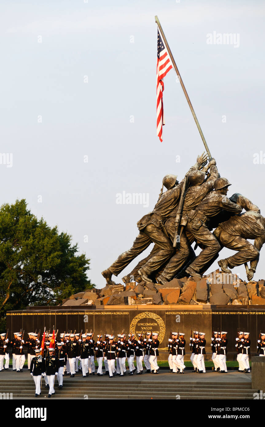 The Marine Corps Silent Drill Platoon performing at the Marine Corps Sunset Parade at the Marine Corps War Memorial (Iwo Jima Memorial) next to Arlington National Cemetery Stock Photo