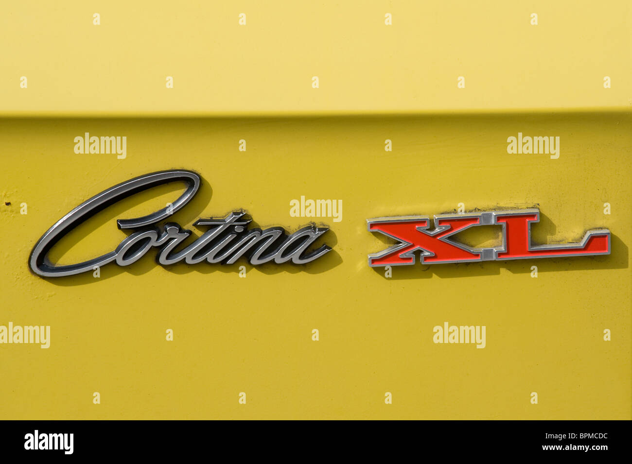 Badge Yellow Ford Cortina XL estate restored British classic motor car  Stock Photo - Alamy