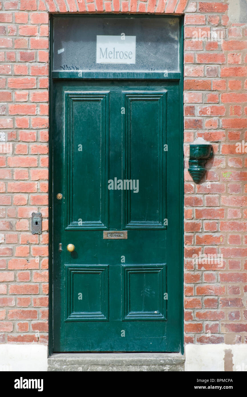 Victorian paneled green front door of brick built terraced house in ... Victorian paneled green front door of brick built terraced house in ...