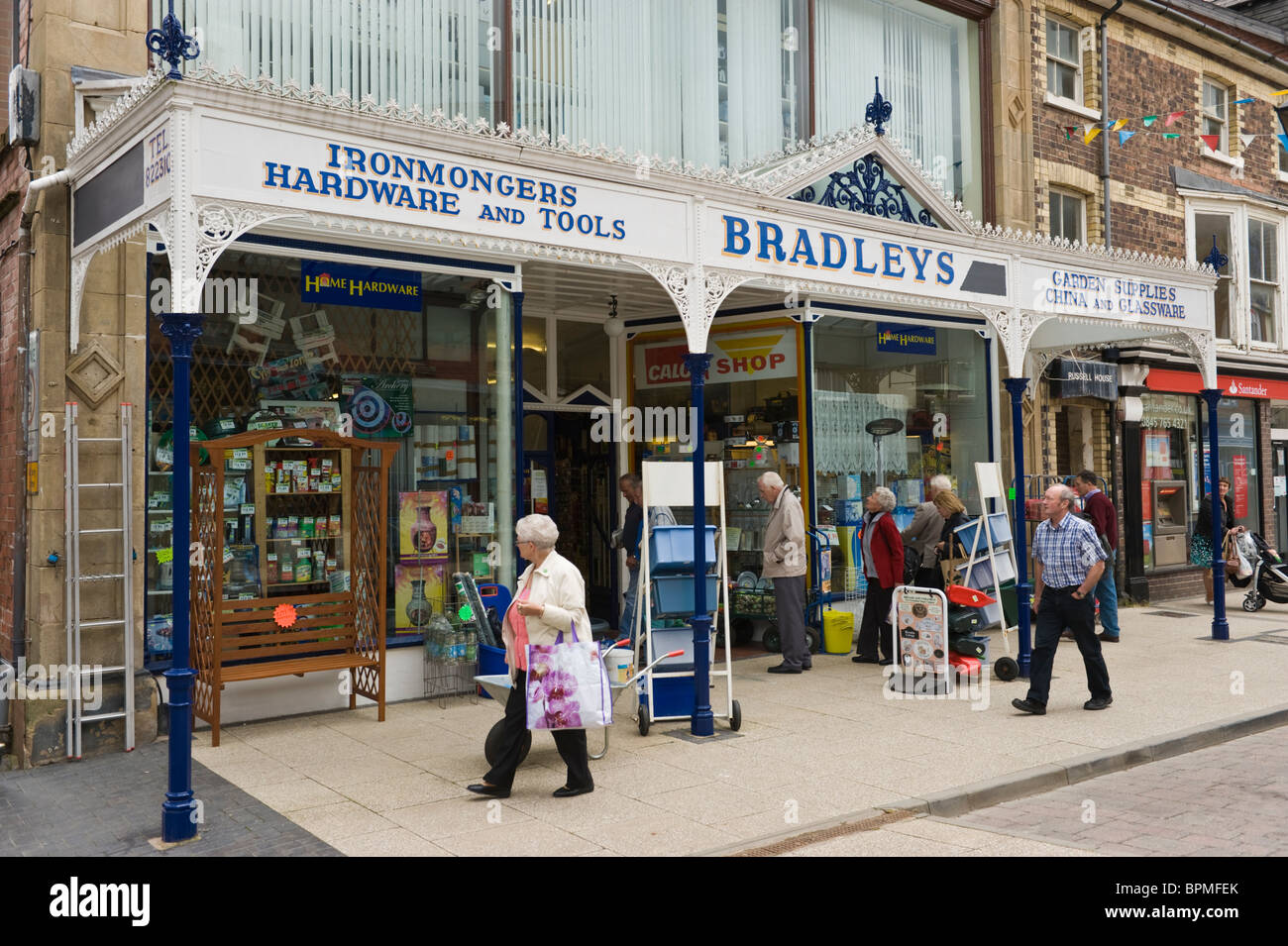 Victorian shop front with ornate canopy of Bradleys traditional ironmongers in Llandrindod Wells Powys Mid Wales UK Stock Photo