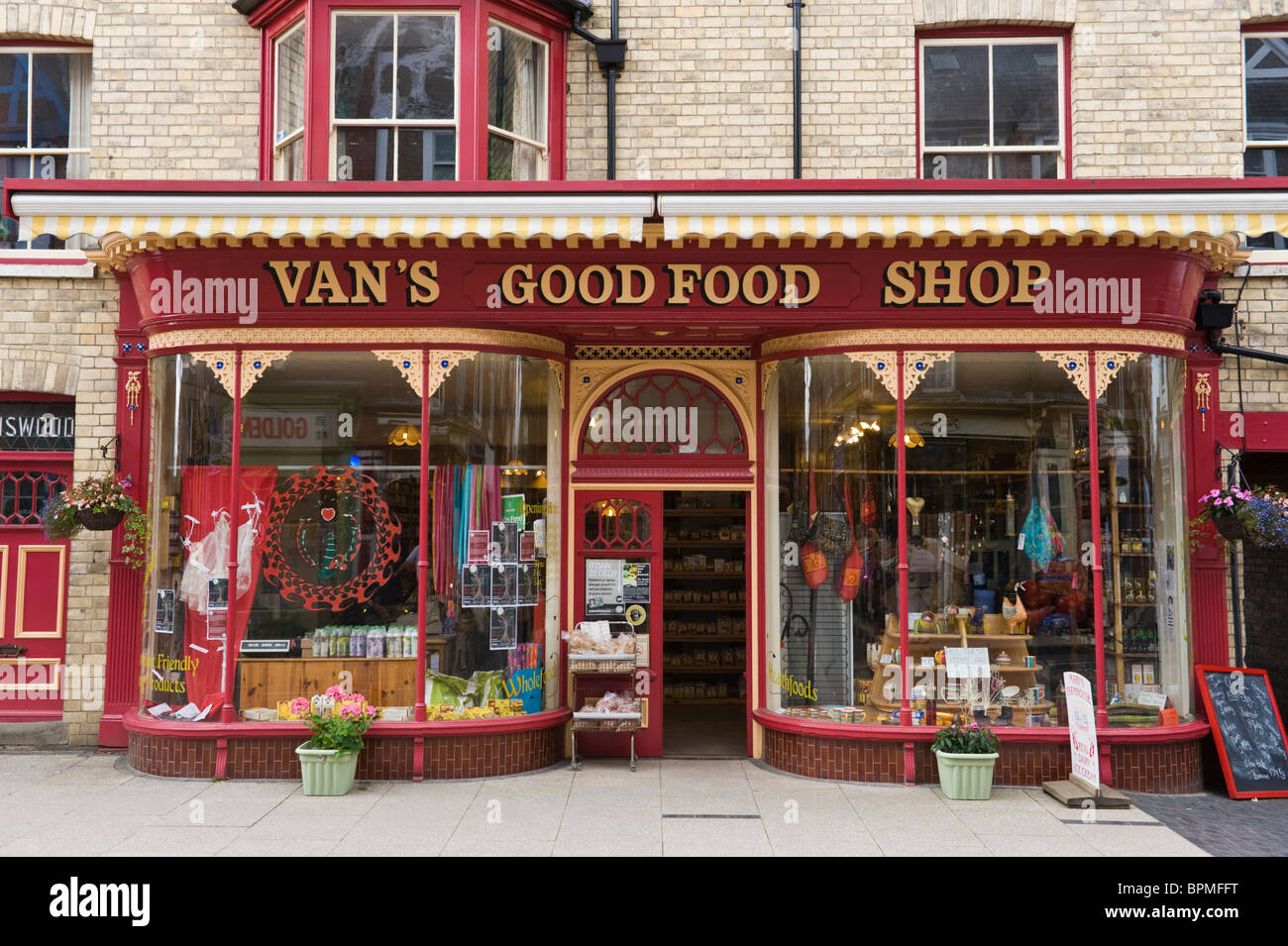 Victorian shop front of Van's local wholefood shop in Llandrindod Wells Powys Mid Wales UK Stock Photo