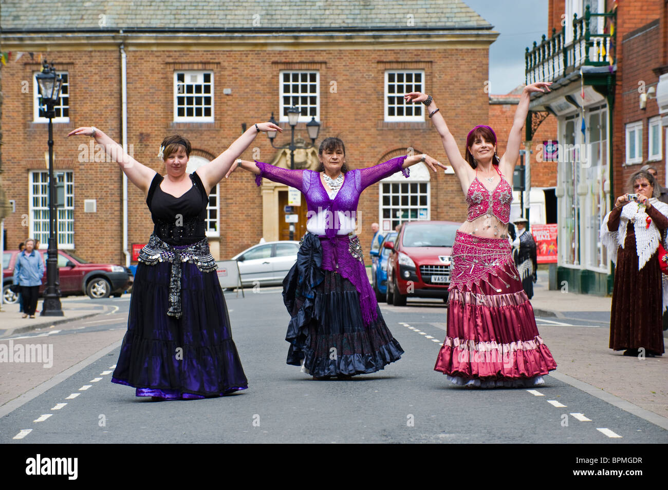 Belly dancers perform in the street during Llandrindod Wells Victorian Festival Powys Mid Wales UK Stock Photo