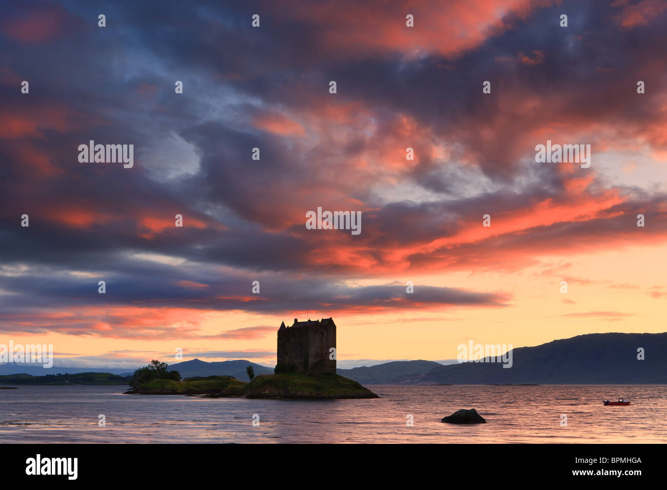 Castle Stalker is a four-storey tower house or keep picturesquely set on a tidal islet on Loch Laich, an inlet off Loch Linnhe Stock Photo