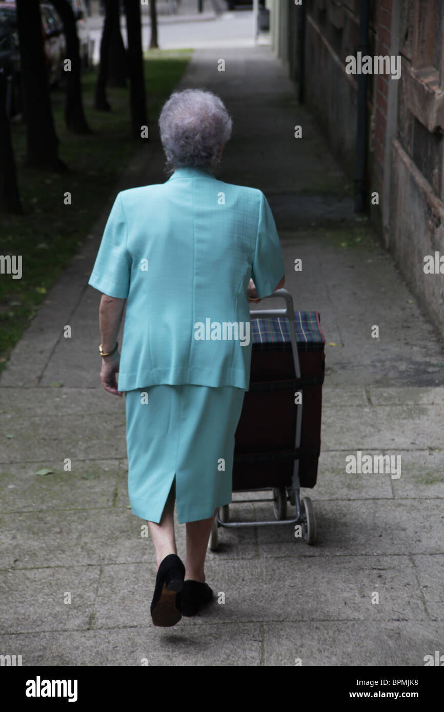 Old lady shopping trolley hi-res stock photography and images - Alamy
