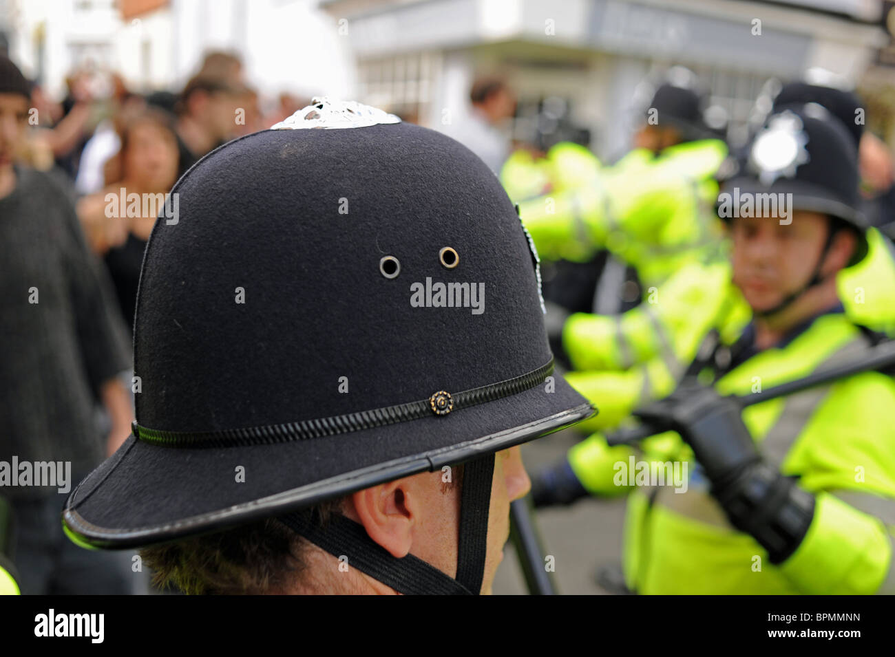Sussex Police with batons keep control of crowds angry at ENA march through Brighton UK Stock Photo