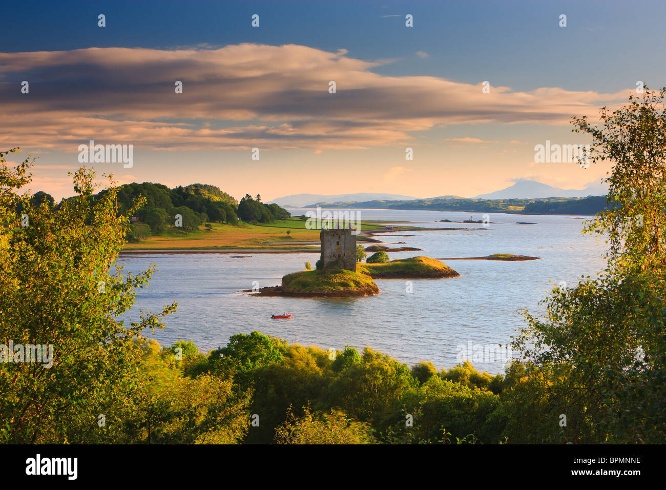 Castle Stalker is a four-storey tower house or keep picturesquely set on a tidal islet on Loch Laich, an inlet off Loch Linnhe Stock Photo