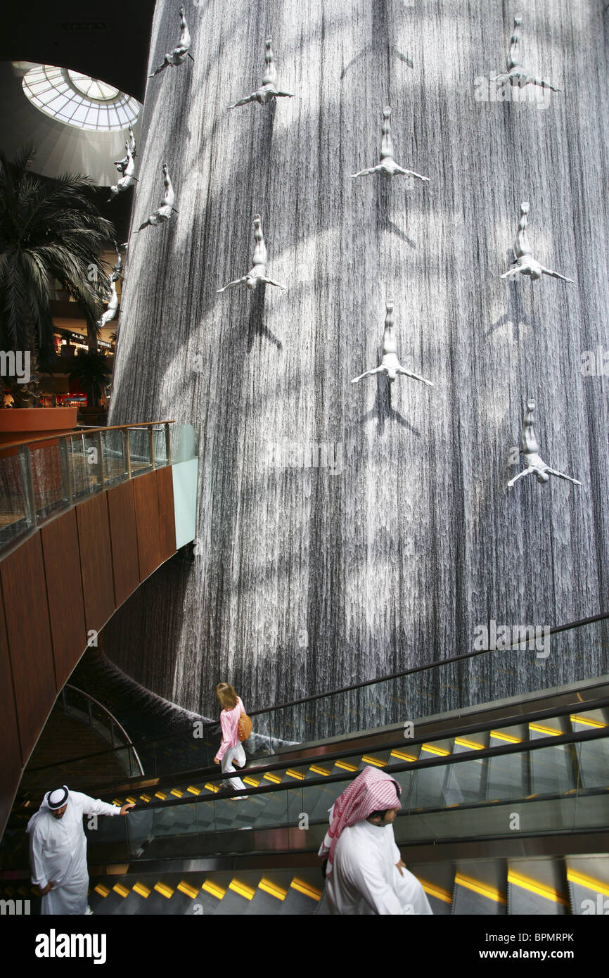 Giant waterfall with sculptures inside Dubai Shopping Mall, Dubai, UAE