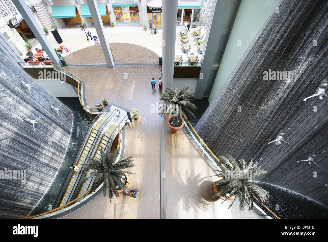 Giant waterfall with sculptures inside Dubai Shopping Mall, Dubai, UAE