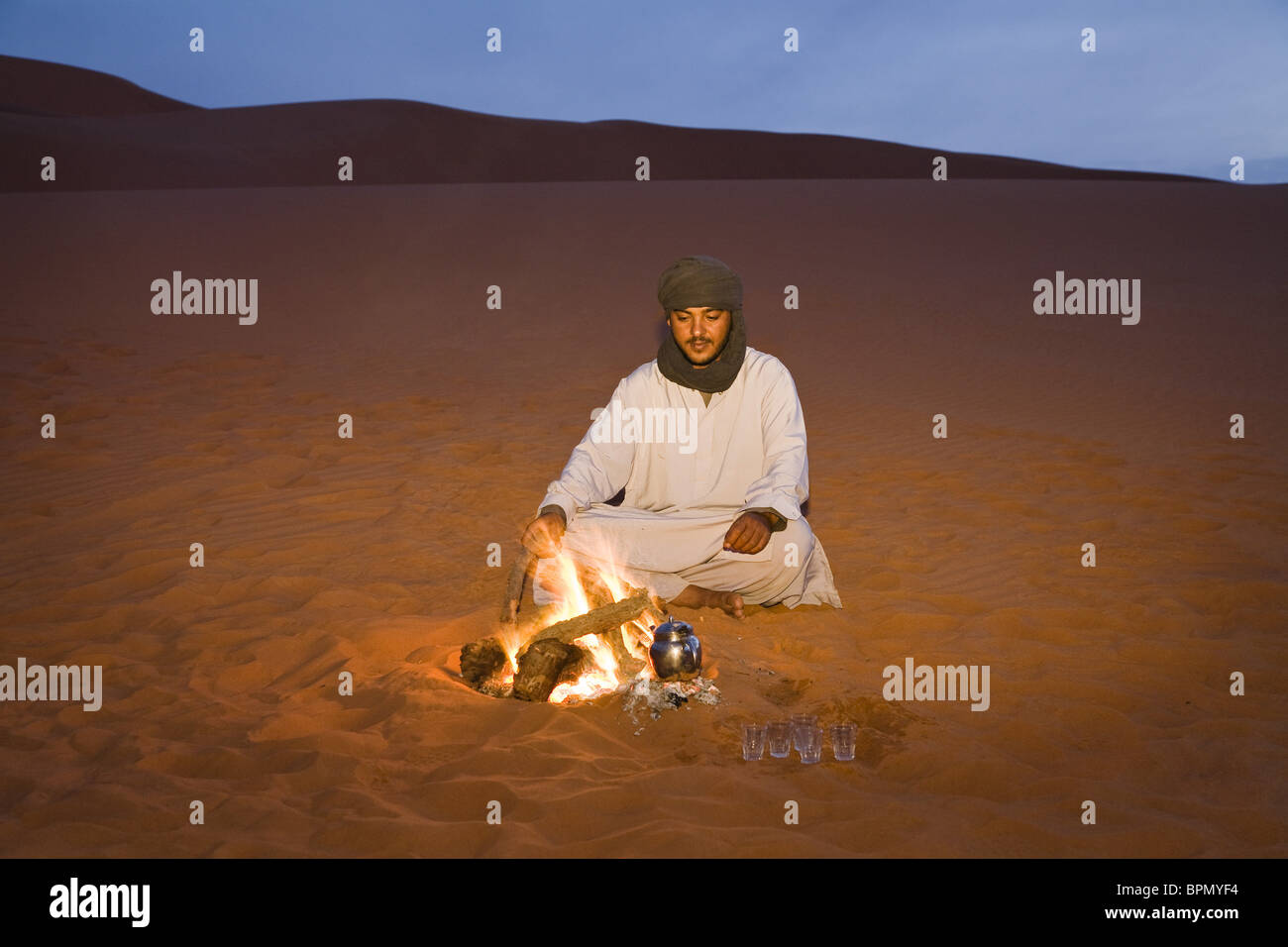 tuareg preparing tea at campfire, Libya, Africa Stock Photo