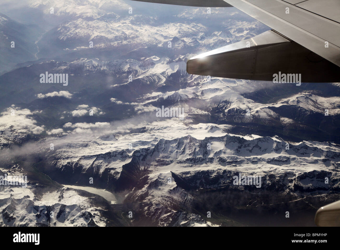 A view of the snow-covered peaks of the European Alps in France from a passenger aeroplane Stock Photo