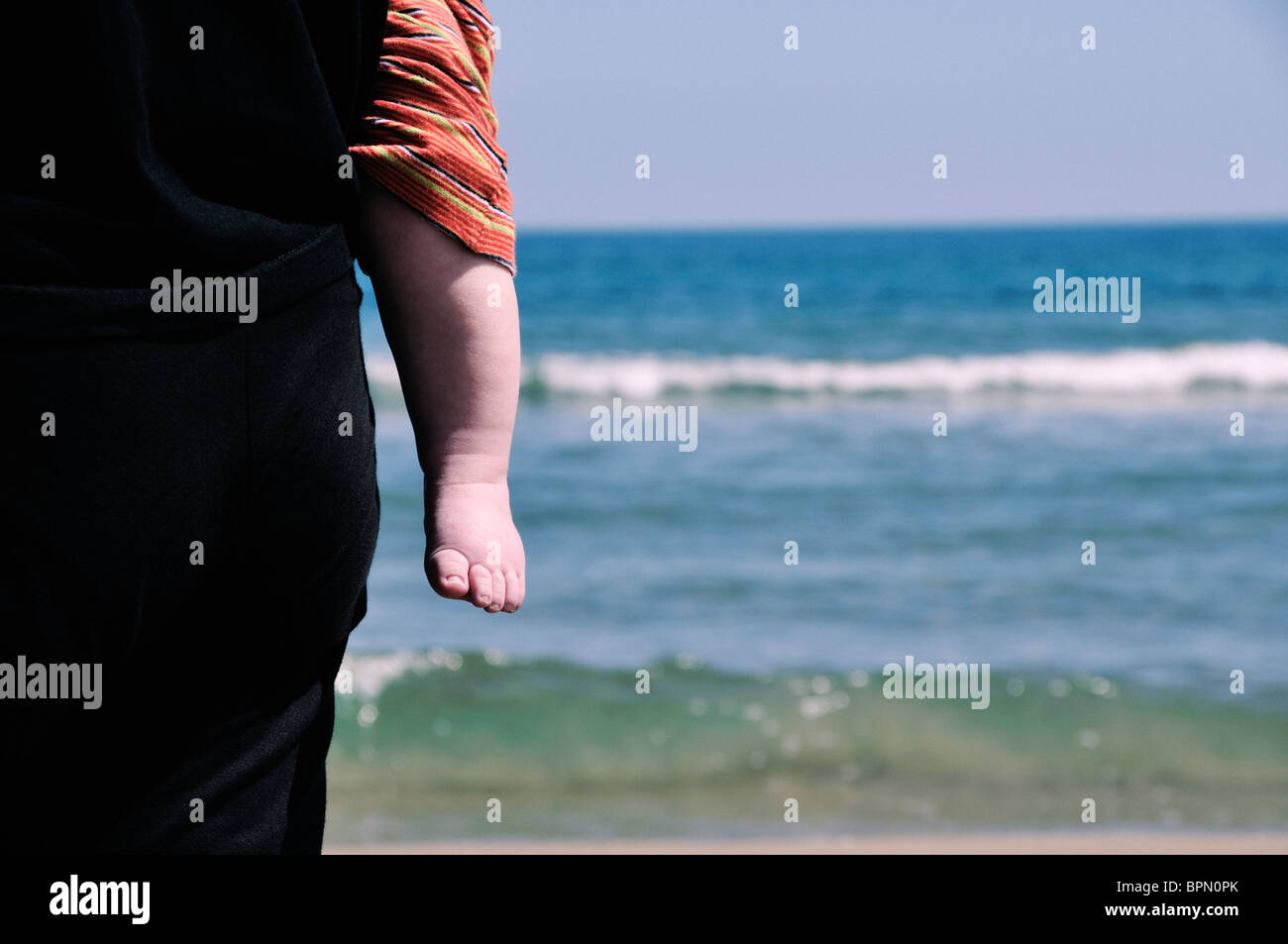 Mother and son by the seashore Stock Photo