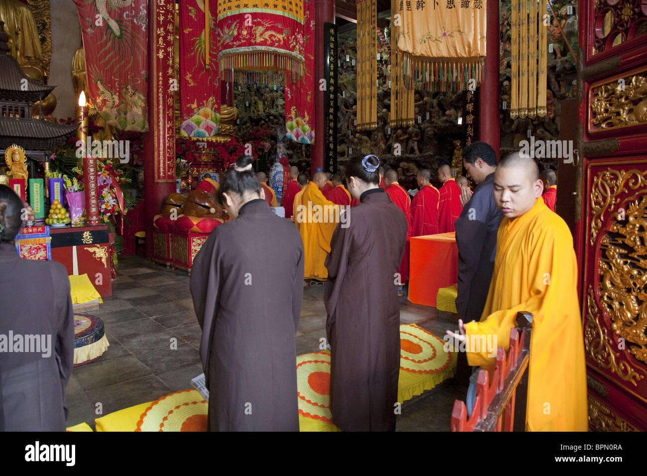 Monks and laymen during a buddhist ceremony, main hall of the Taihua
