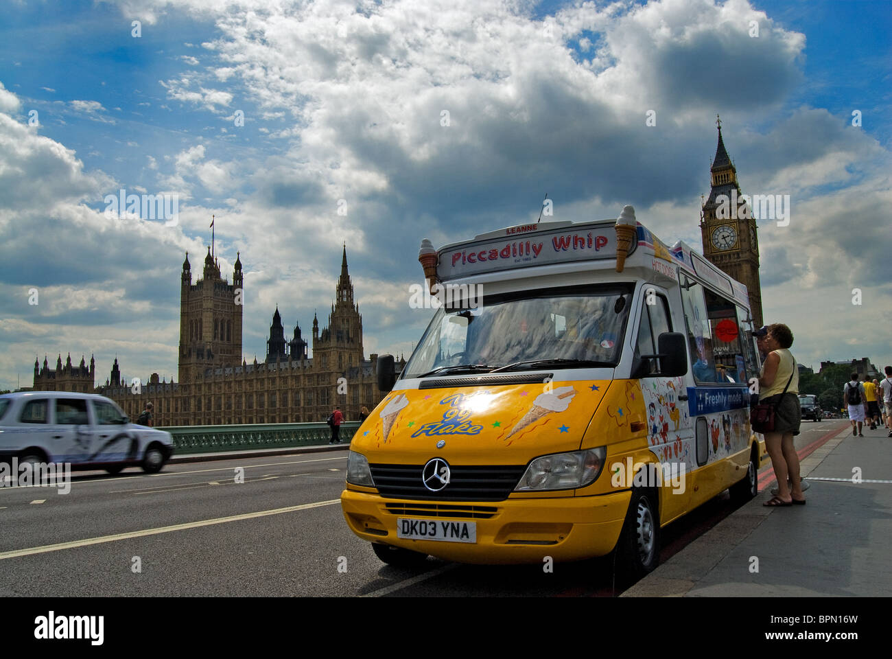 Ice cream van on bridge at Westminster with Houses of parliament in the background. Stock Photo