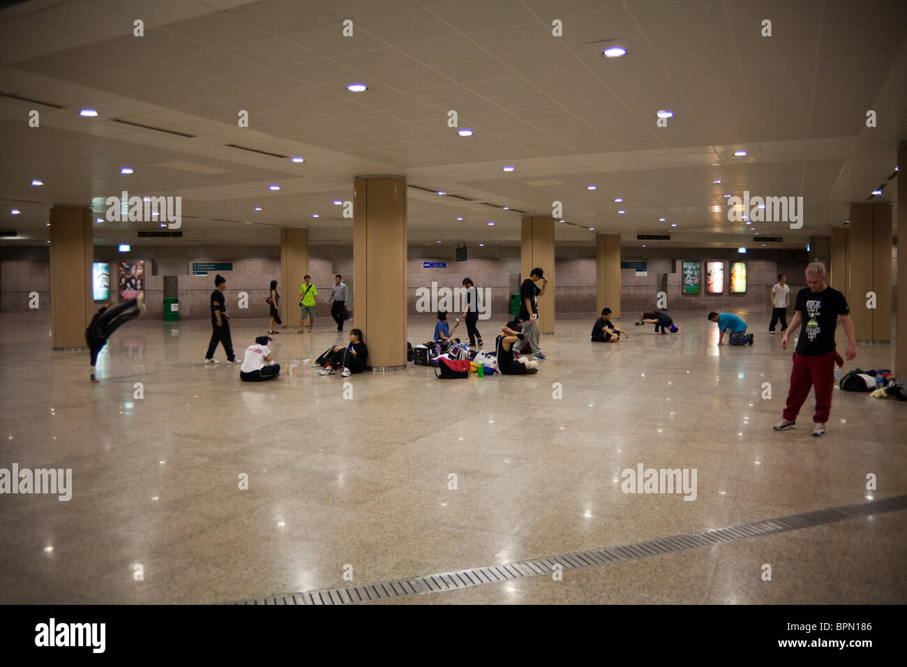 youths practising hip hop dancing in underpass near Esplanade theatres, Singapore Stock Photo