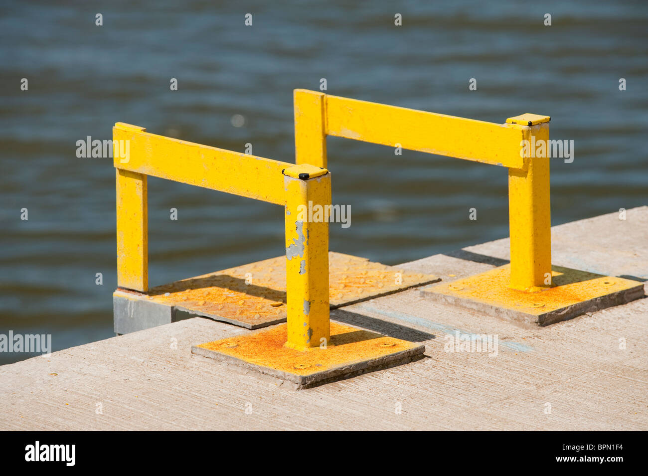 Yellow ladder steps at edge of river Stock Photo Alamy
