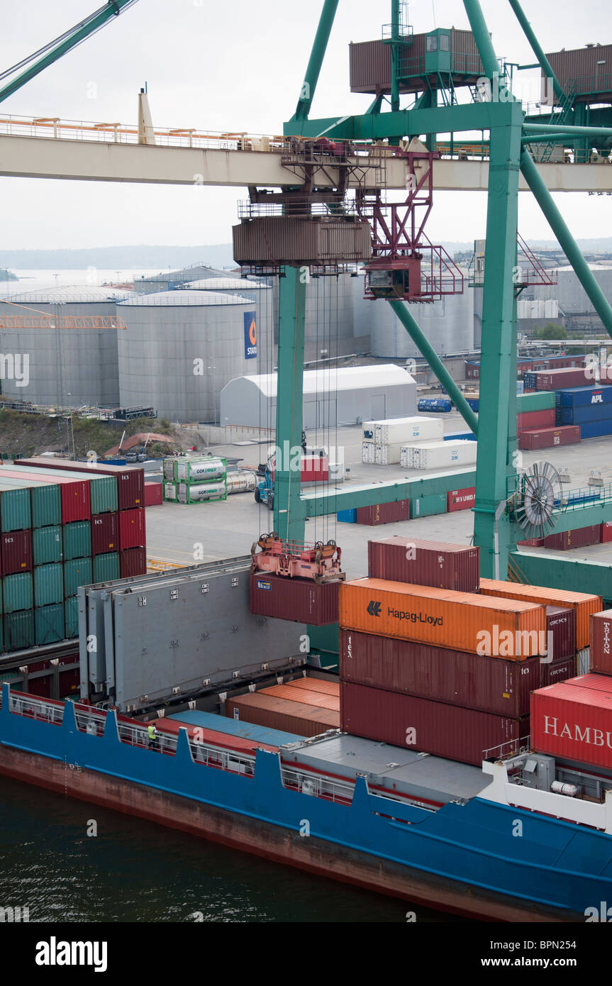 A shipping container being loaded onto a Container ship in the port of ...