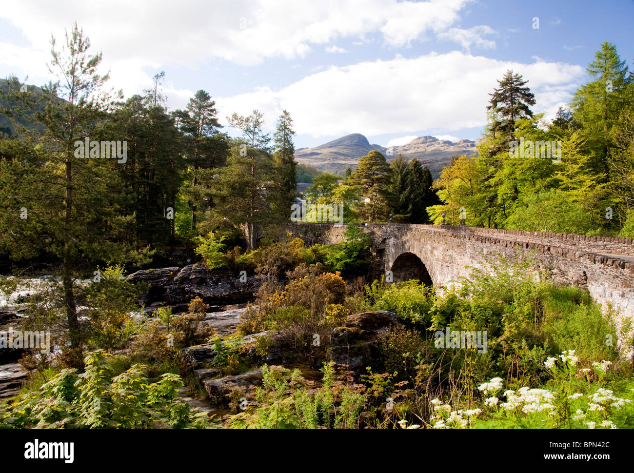 Dochart River and Falls with arched stone bridge leading into village of Killin, Stirlingshire Scotland Stock Photo