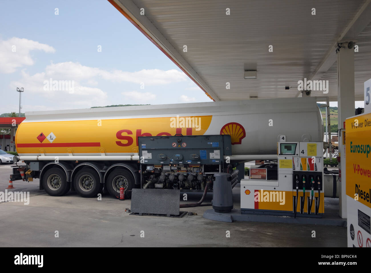 Luxembourg, Europe. Shell oil tanker delivering petrol to a filling station Stock Photo