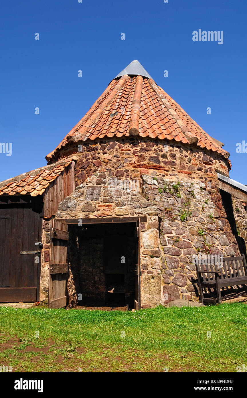 The conical roofed drying kiln of Preston Mill, East Lothian, Scotland. This attractive pantiled
