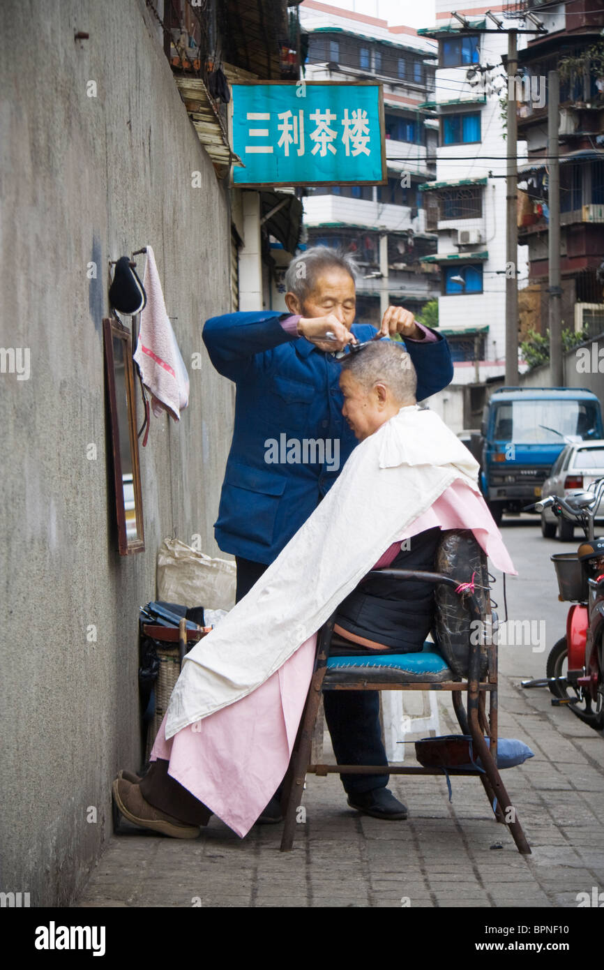 Street hair cut hi-res stock photography and images - Alamy