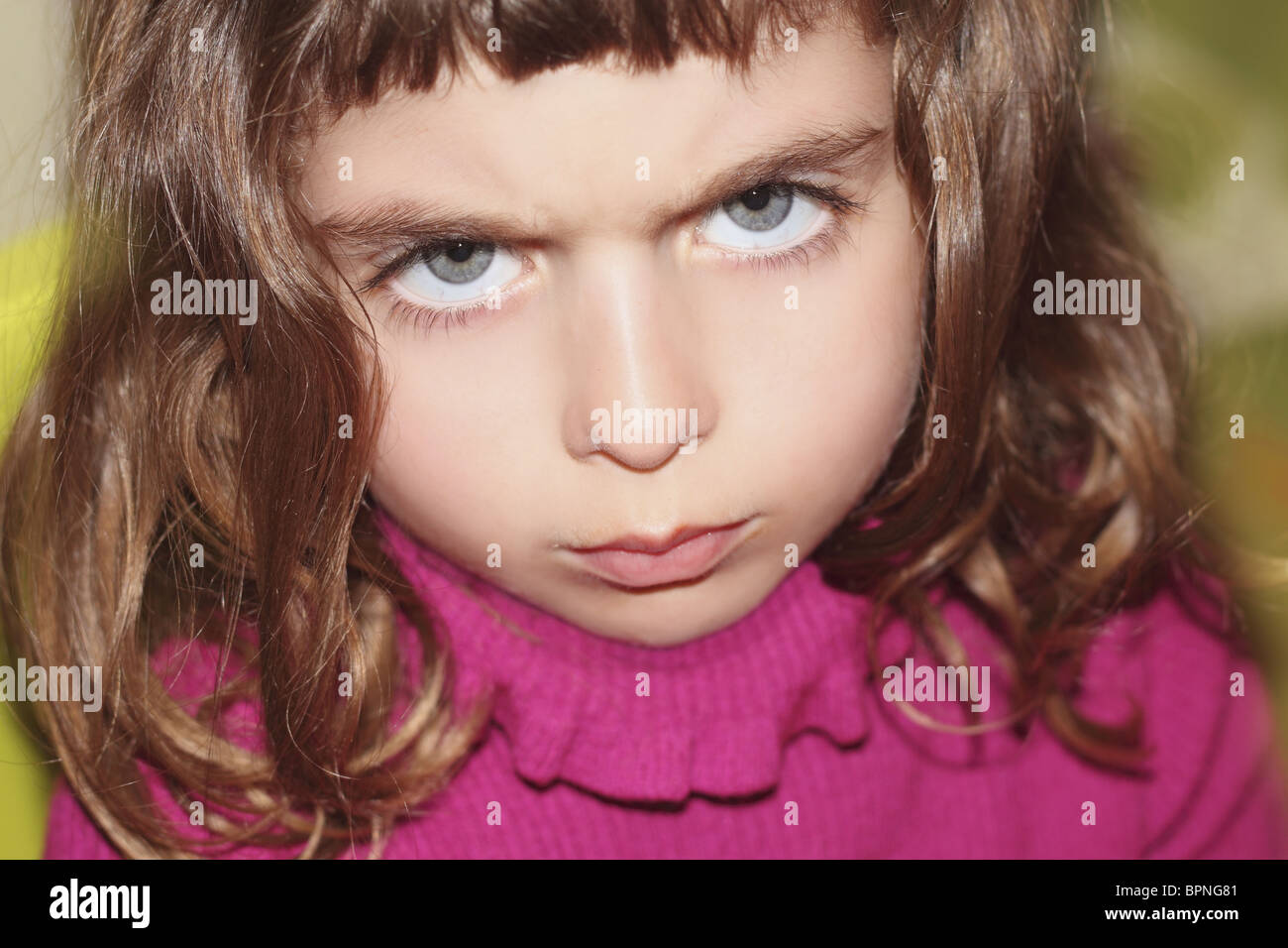 defy outface little girl portrait looking camera gesture blue eyes Stock Photo