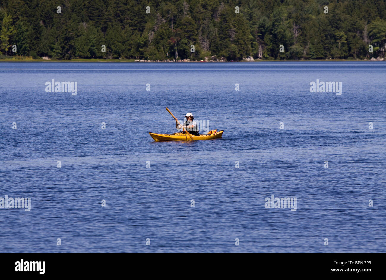 Man in kayak on Eagle lake in Acadia National Park, Maine Stock Photo