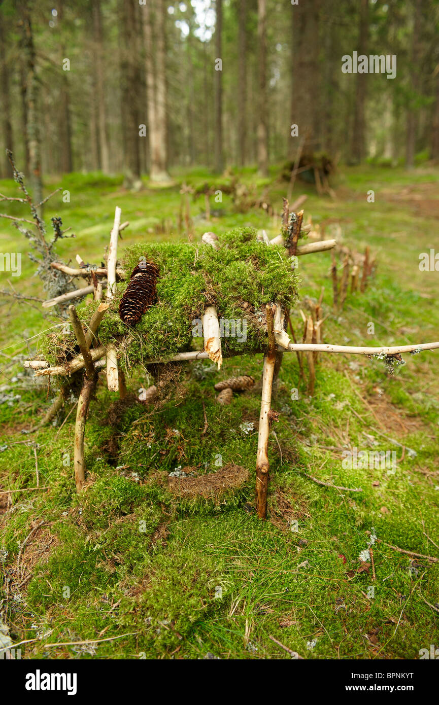 Wooden house for dwarf in forest - build by children Stock Photo